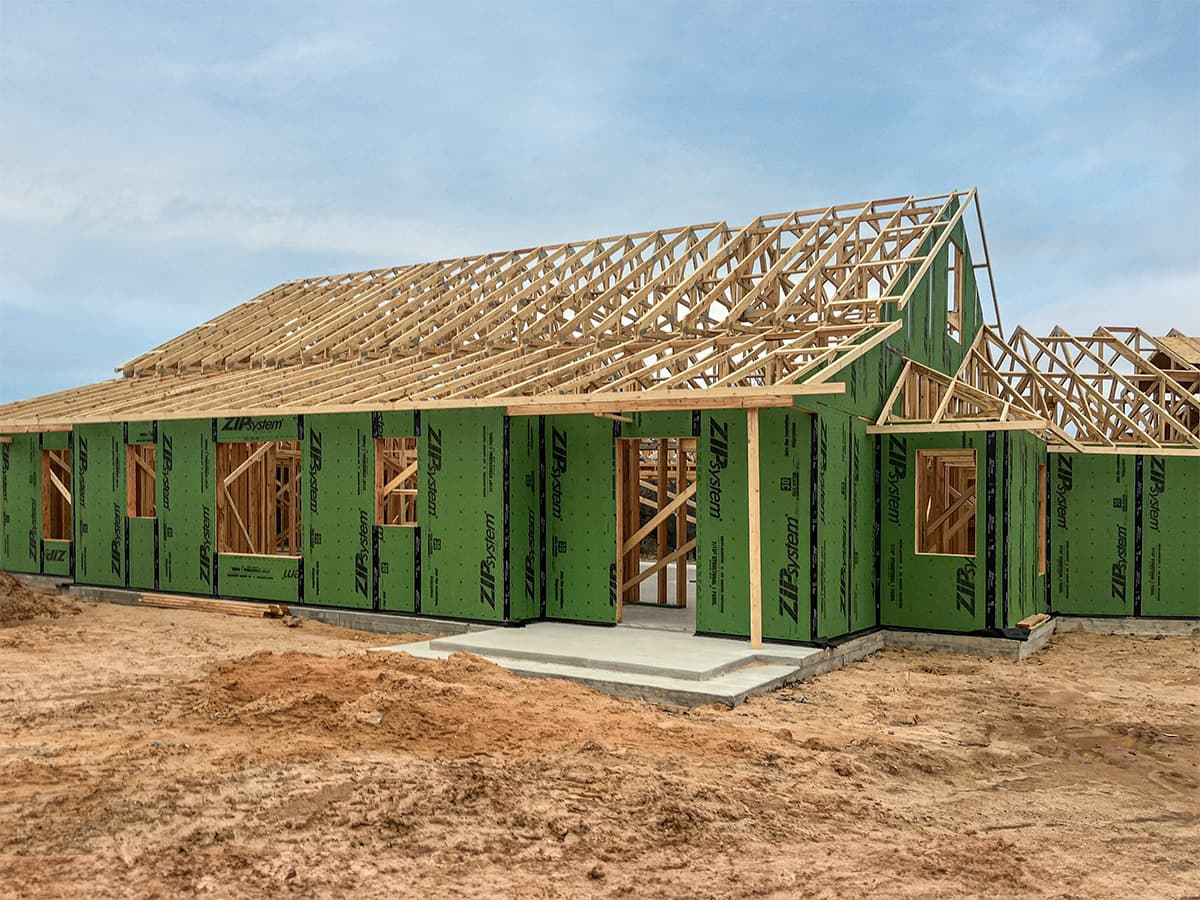 Exterior view of staff housing project with intalled roof trusses