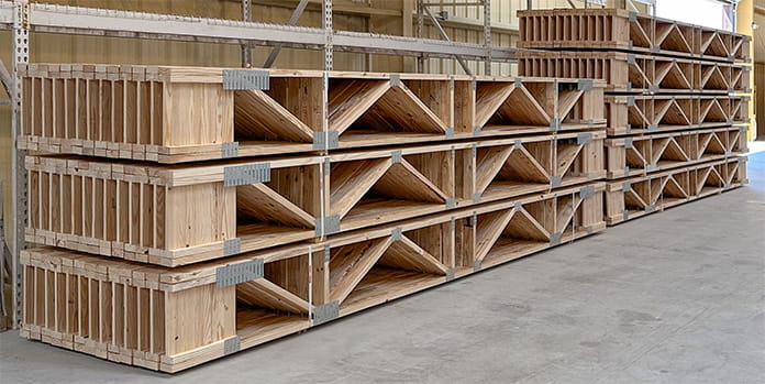 Assembled and stacked trimmable floor trusses ready to be delivered