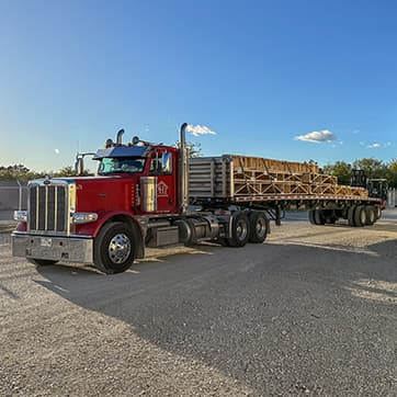 Delivery truck with a load of floor trusses