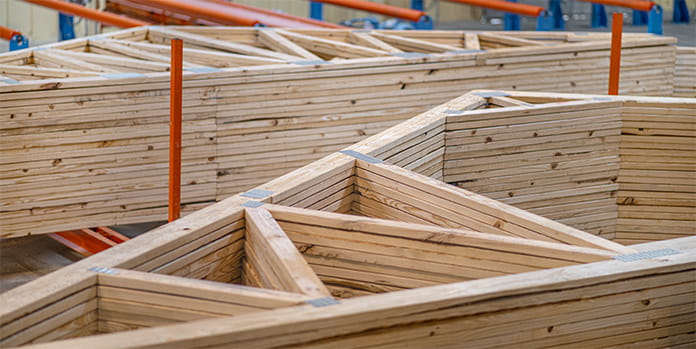 Assembled and stacked roof trusses ready to be delivered